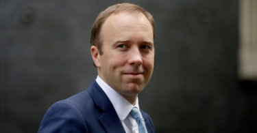 UK health minister admits virus rules breach with embrace