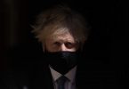 UK's Johnson stands by health secretary who broke Covid rules kissing aide