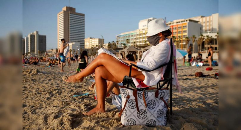 Israel resumes indoor mask requirement amid virus spike