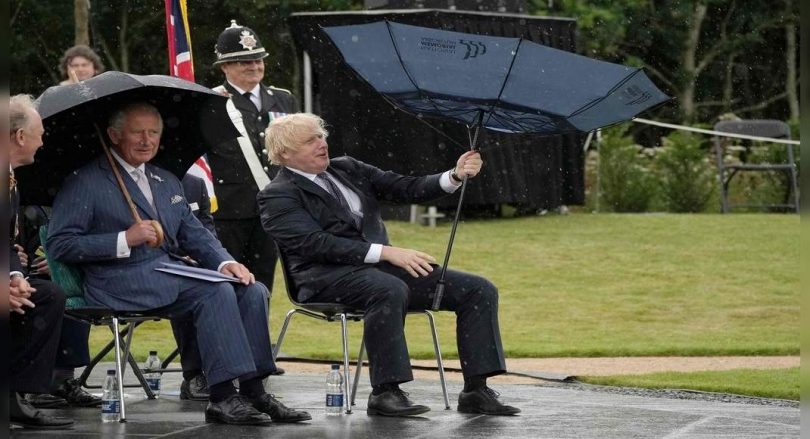 UK PM Johnson's Umbrella Mishap Amus Prince Charles