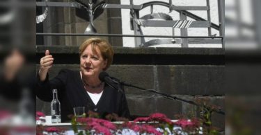 German Chancellor Angela Merkel said the world must rush against climate change; European Flood Toll 188