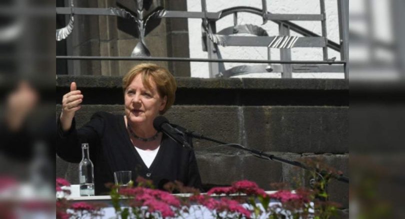 German Chancellor Angela Merkel said the world must rush against climate change; European Flood Toll 188