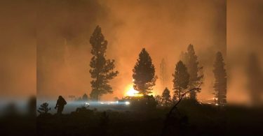 Dangerous conditions complicate wildfire fight in US Western