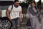 Dharmendra Prakash's wife looks at the airport