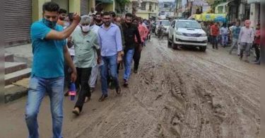 The Minister stopped, taken through Potholed, Muddy Road