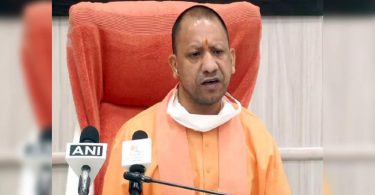 Yogi lifts the sidewalk at the opening of the store on Sunday