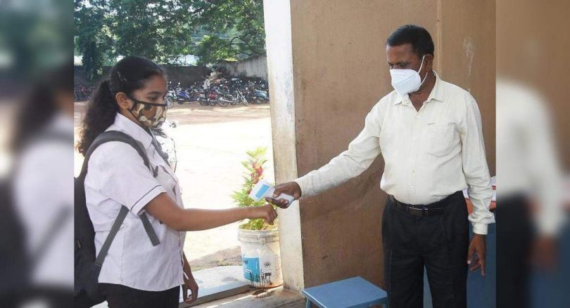 Students return to campus after a long gap; Vibrant but alert.