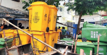 Yellow trash can disappear, covid waste spilled on the road
