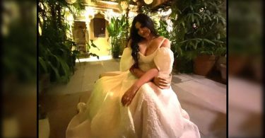 A new bride stuffed in a beautiful white dress