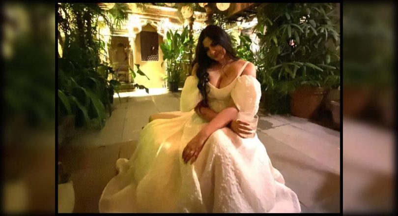 A new bride stuffed in a beautiful white dress