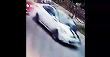 Udaipur Cop CLings on Car Bonnet on a busy road