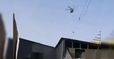 Video: Taliban Flying Chopper with Man Hanging from Rope