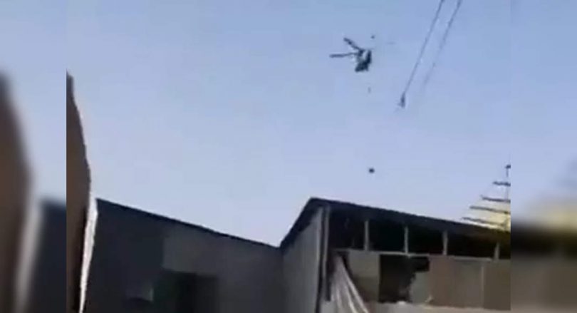 Video: Taliban Flying Chopper with Man Hanging from Rope